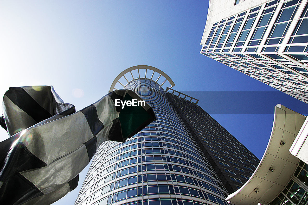 Low angle view of modern buildings against sky