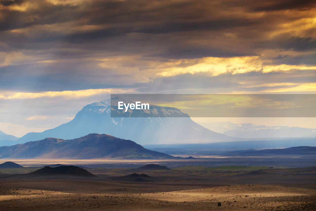 Scenic view of landscape against sky during sunset