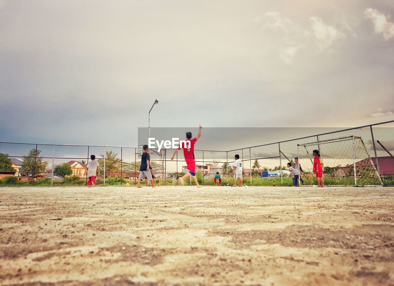 PEOPLE PLAYING SOCCER