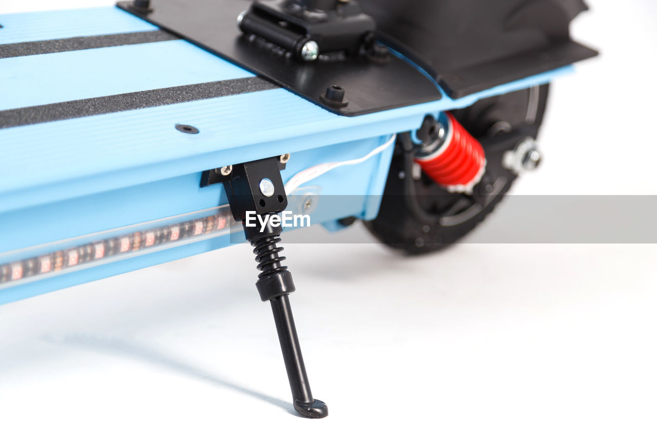 HIGH ANGLE VIEW OF CAMERA ON WHITE TABLE