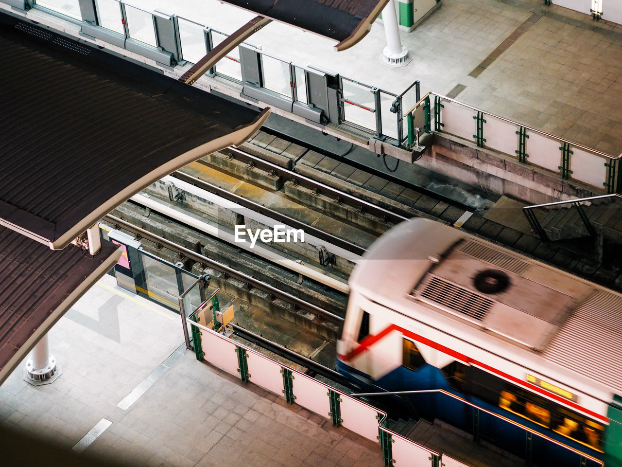 High angle view of train moving at railroad station