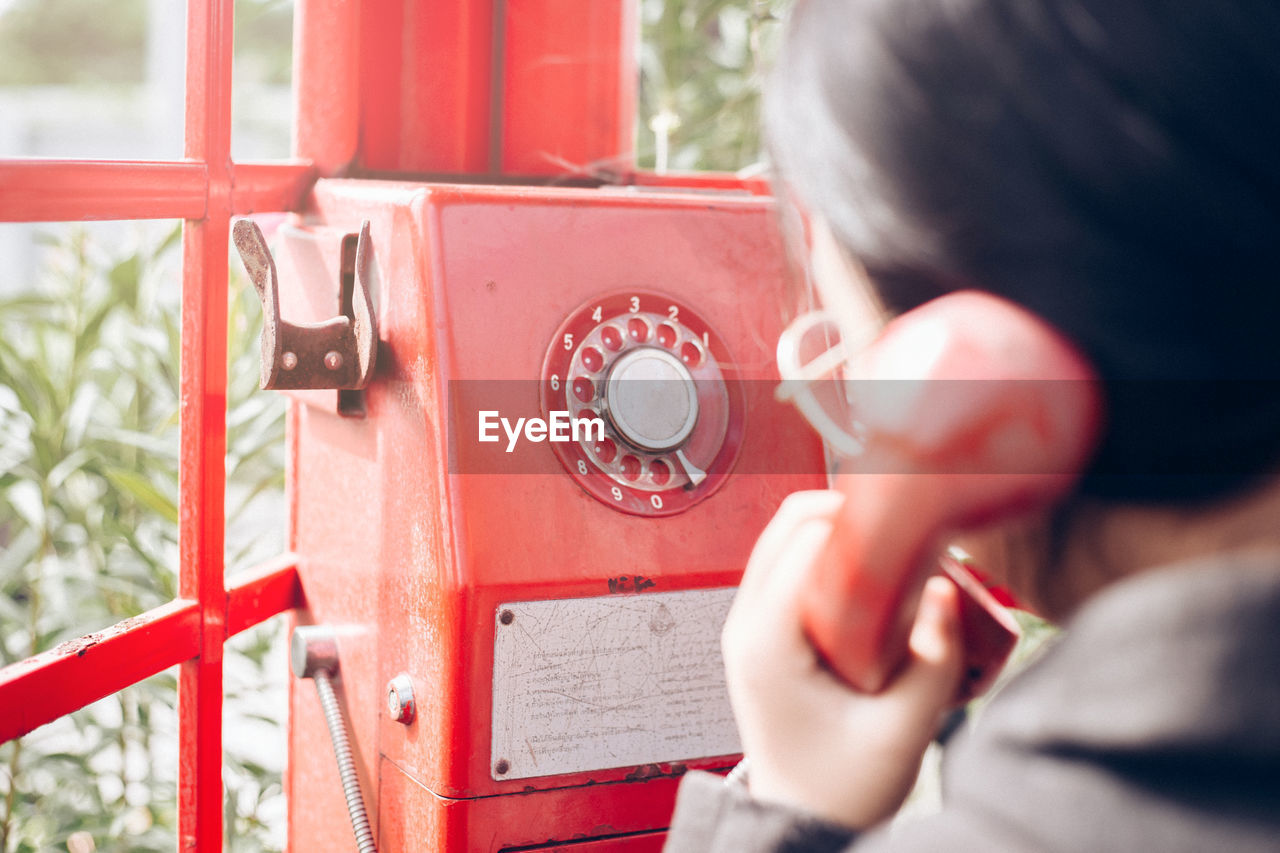 Close-up of woman talking over telephone