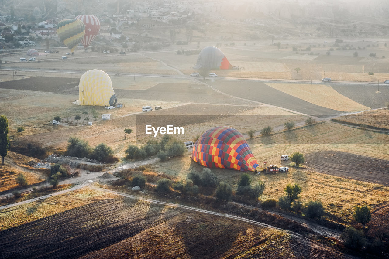 Aerial view of hot air balloon on field