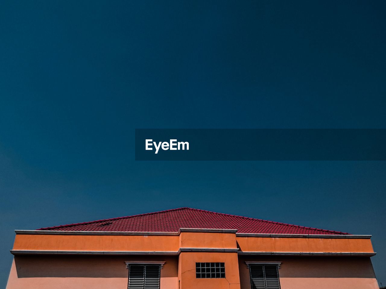 Low angle view of building against blue sky