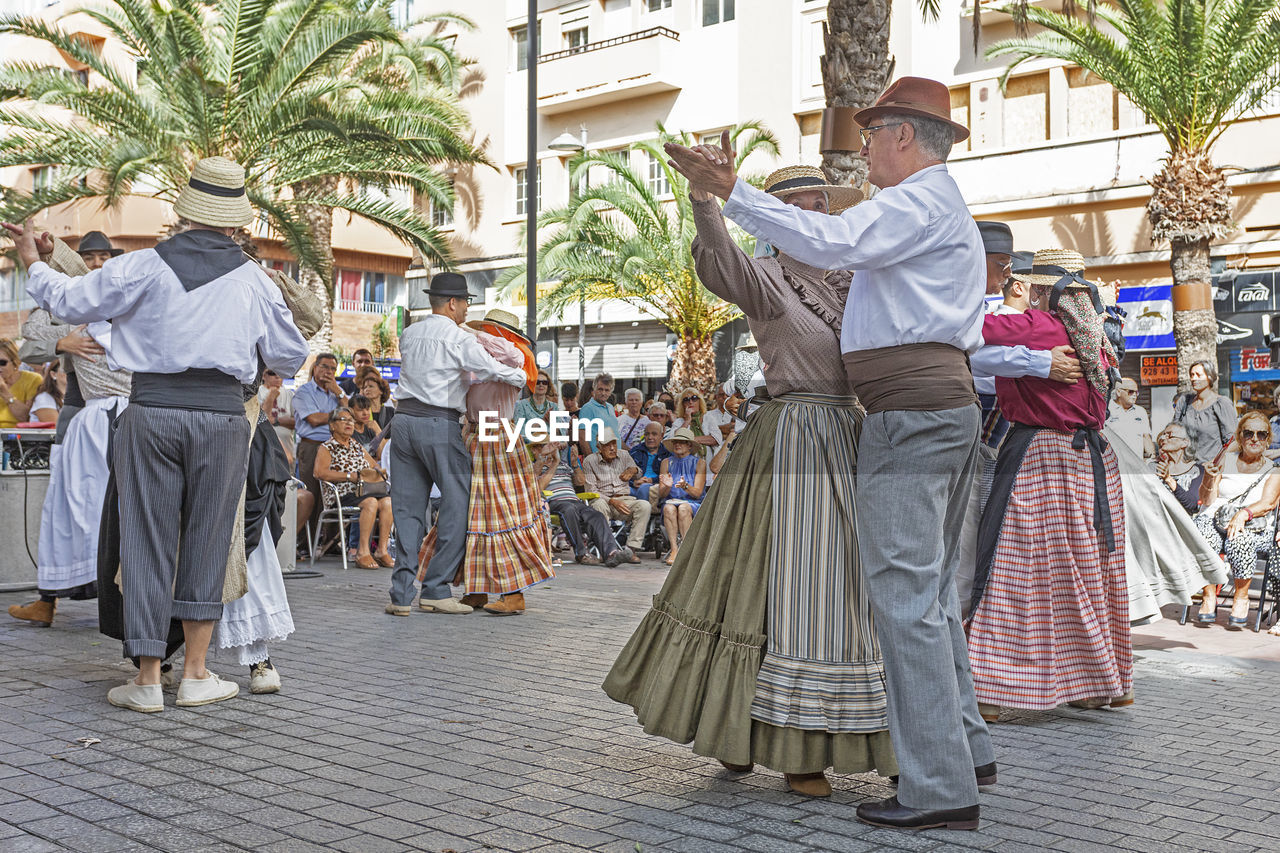 GROUP OF PEOPLE AT MARKET