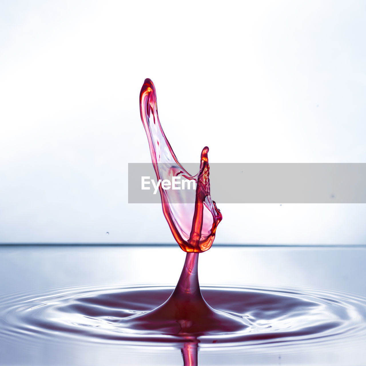 CLOSE-UP OF WATER SPLASHING IN CONTAINER