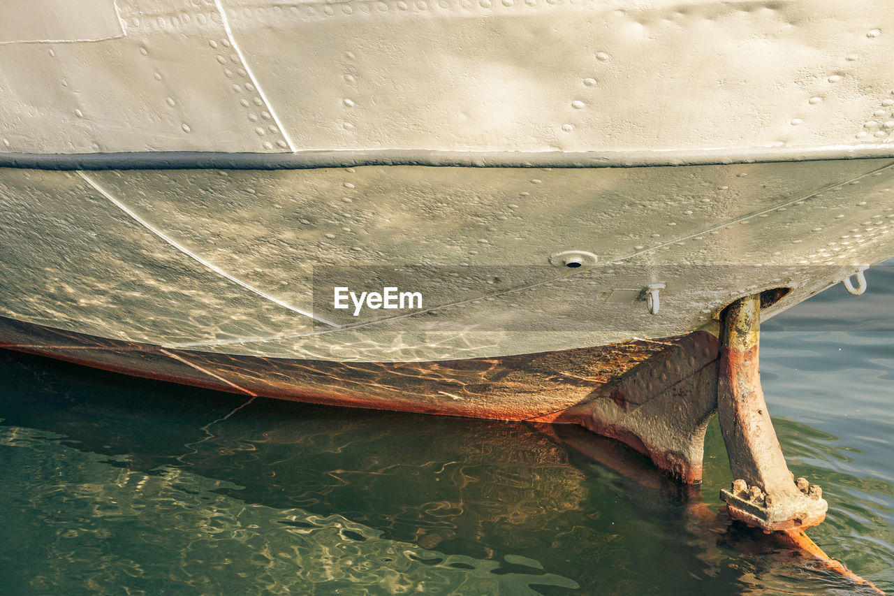 CLOSE-UP OF FISHING BOAT MOORED AT SEA