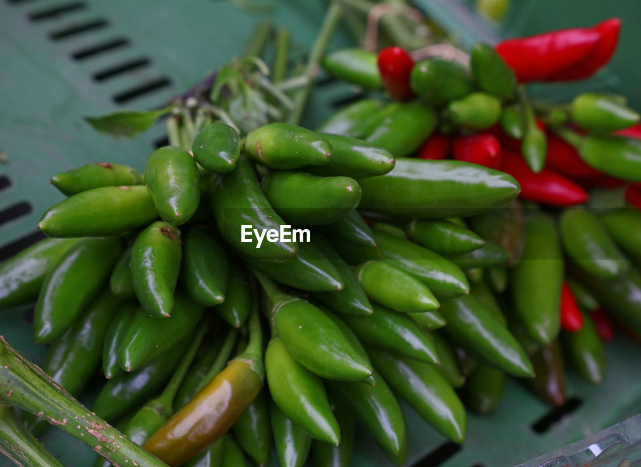 High angle view of chili peppers at market stall