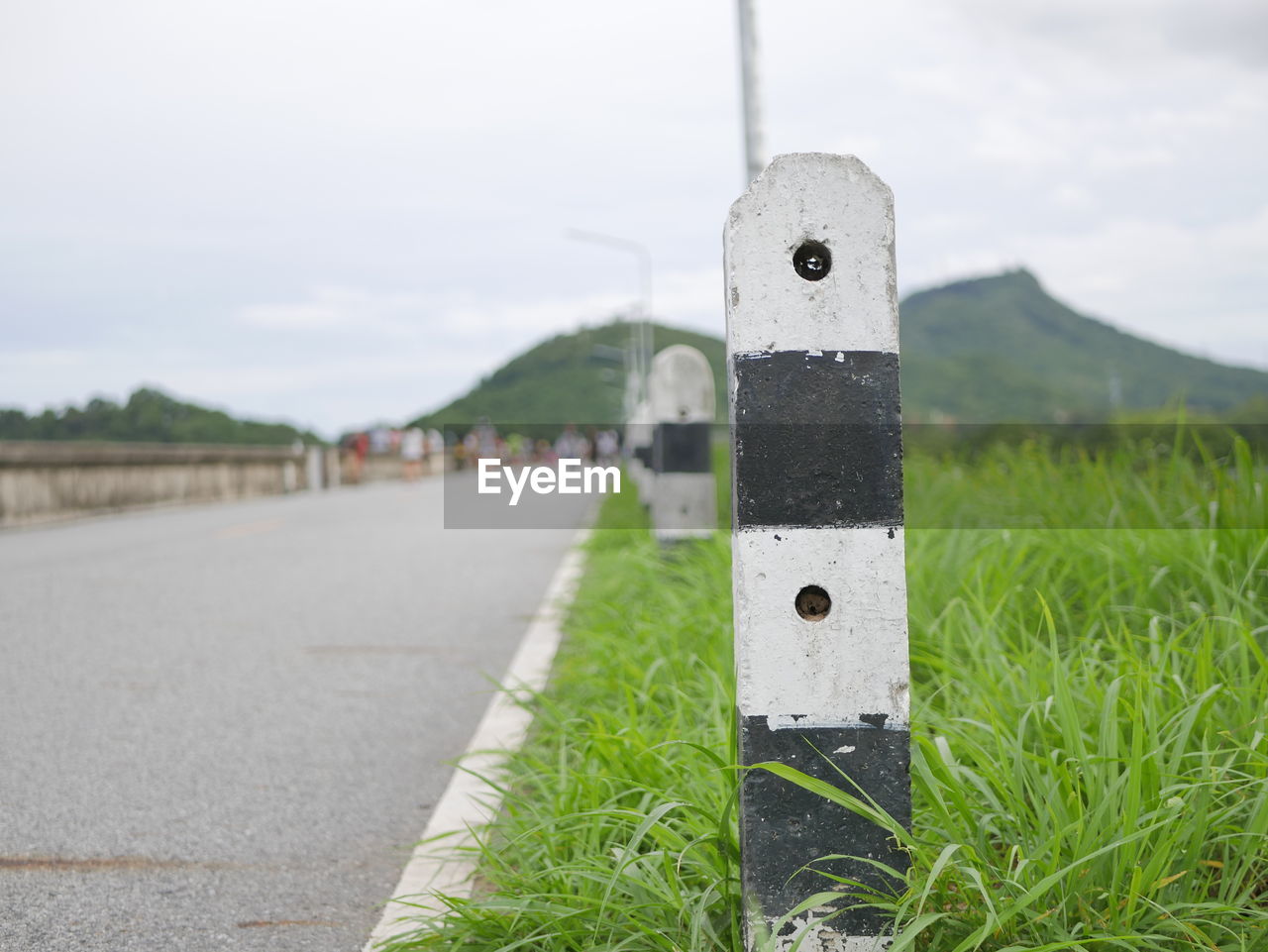 INFORMATION SIGN ON FIELD BY ROAD