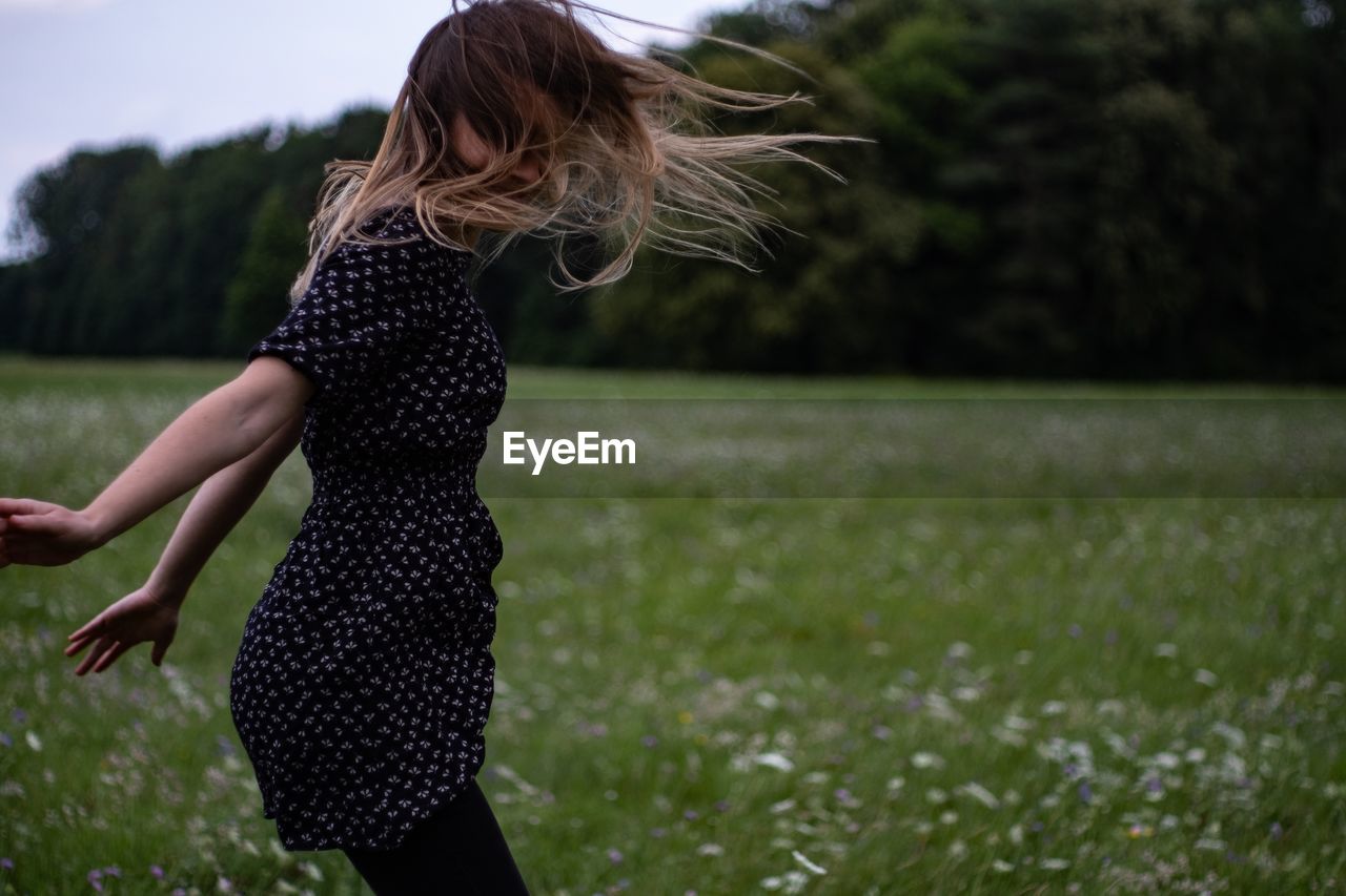 Woman jumping on field