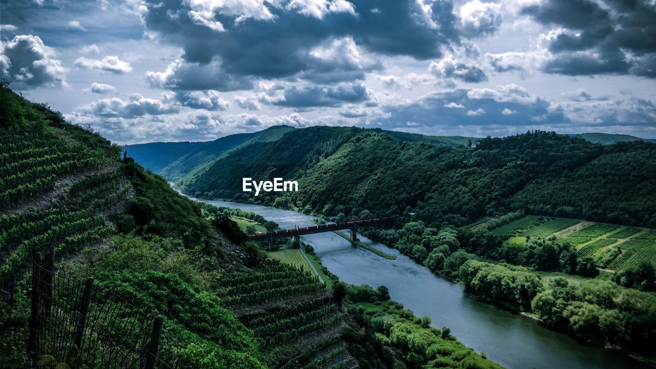 High angle view of river amidst landscape against sky