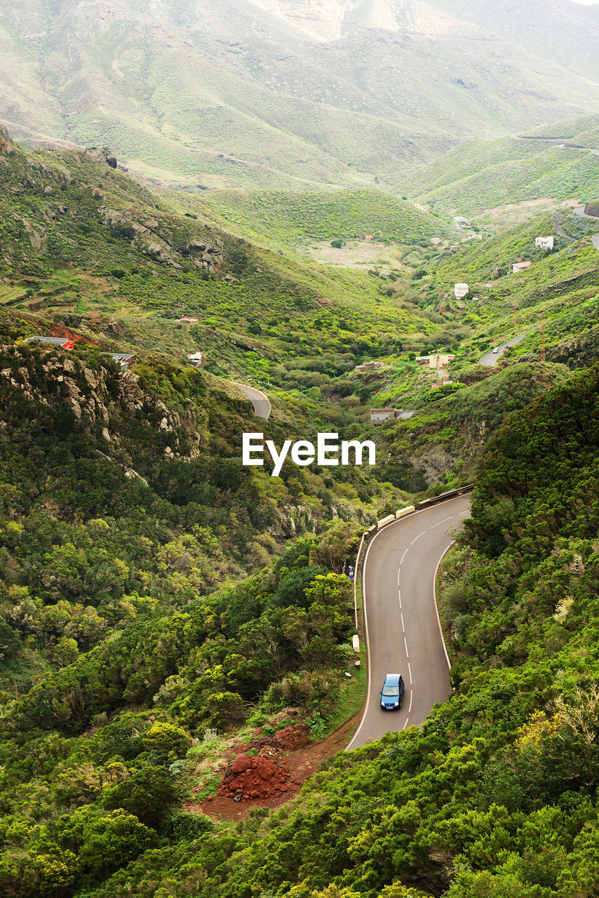 High angle view of car moving on winding road