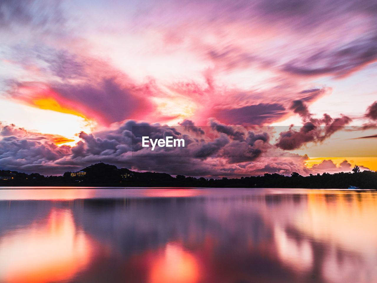 Scenic view of dramatic sky over sea during sunset