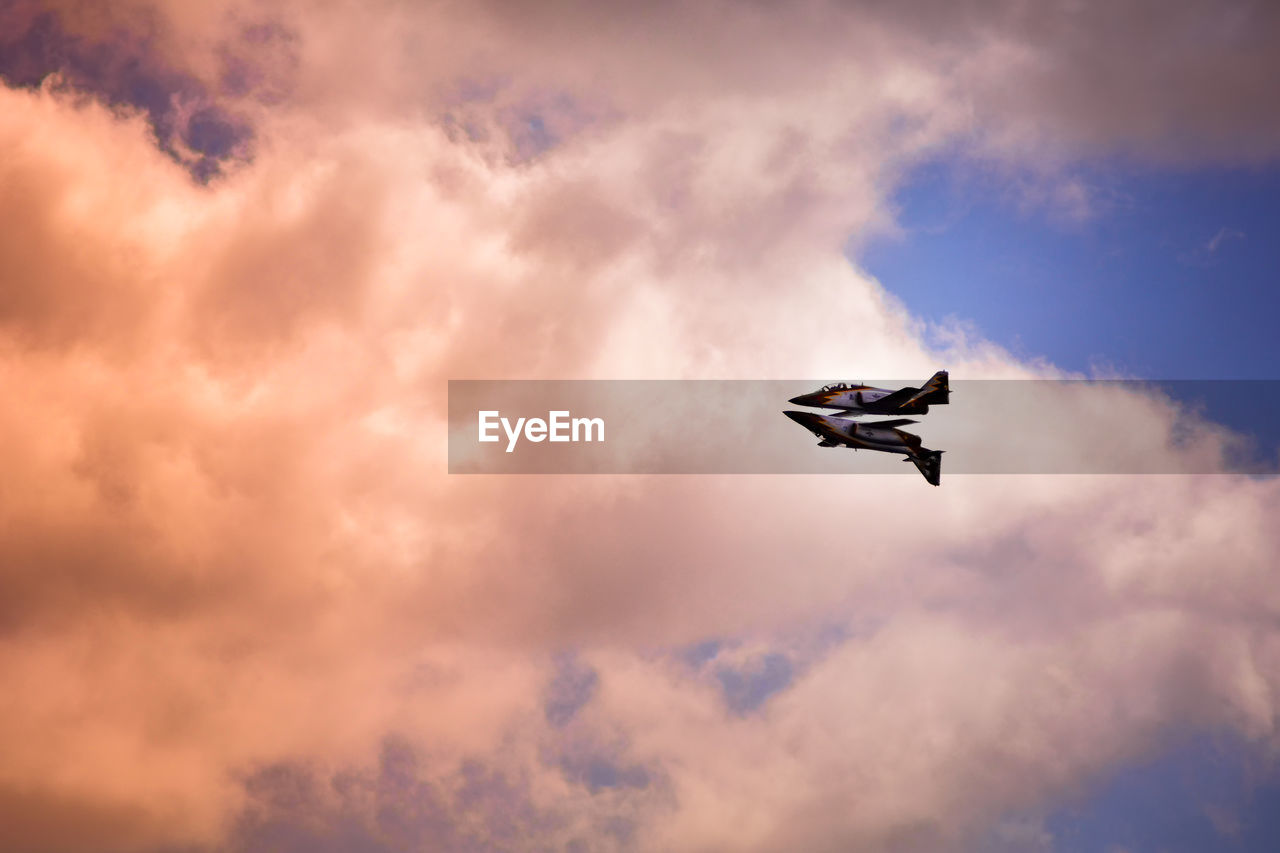 LOW ANGLE VIEW OF AIRPLANE AGAINST SKY