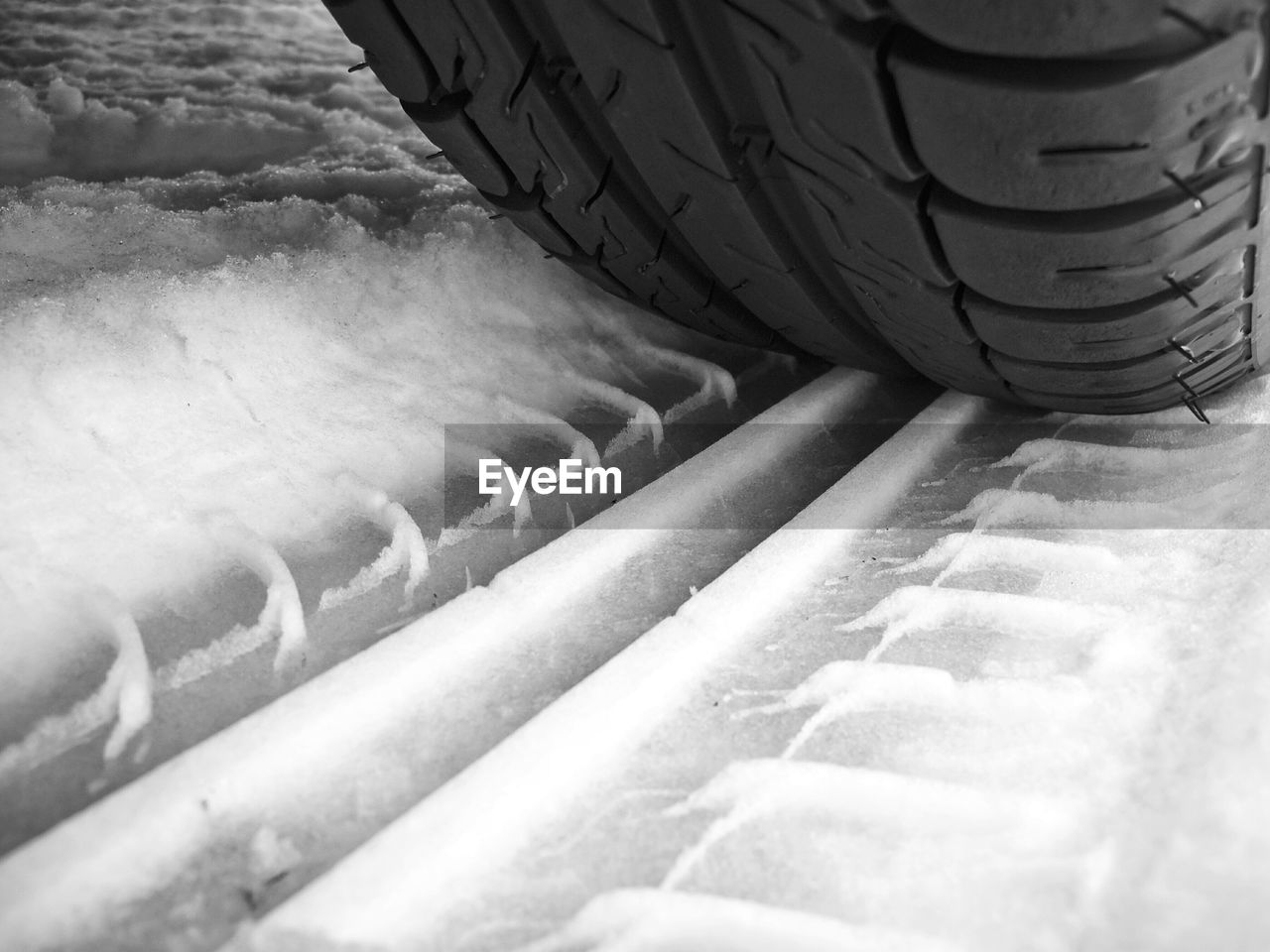 Close-up of tire on snow