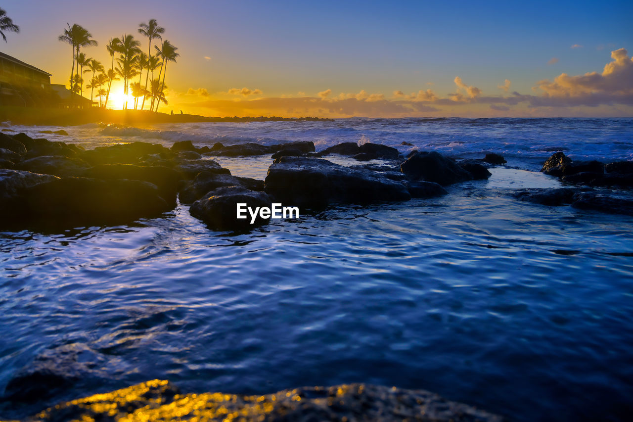 SCENIC VIEW OF SEA DURING SUNSET