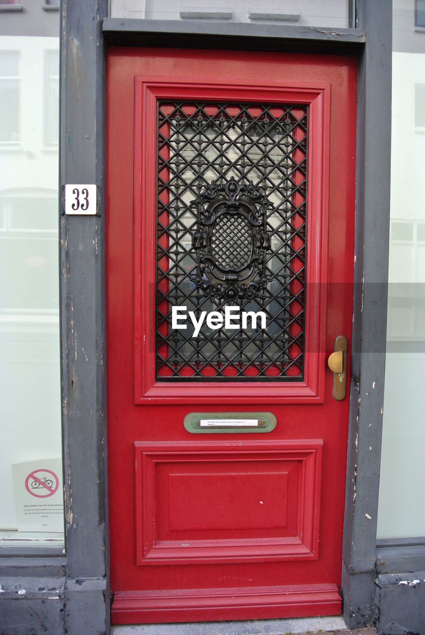 CLOSE-UP OF RED CLOSED DOOR