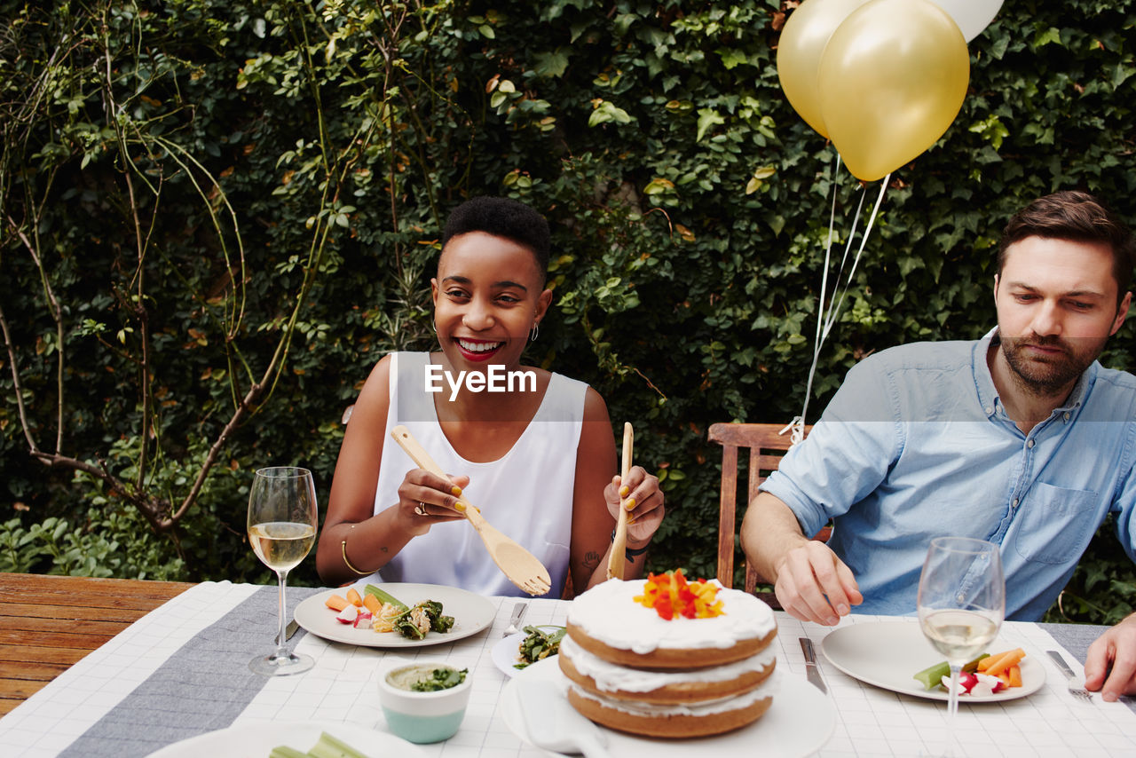 Smiling couple enjoying food