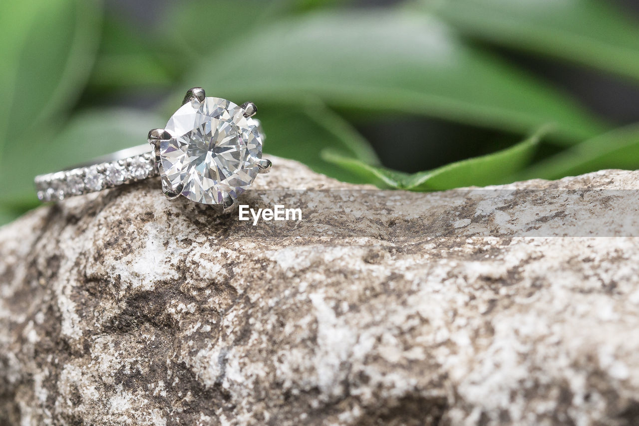 Close-up of diamond ring on rock