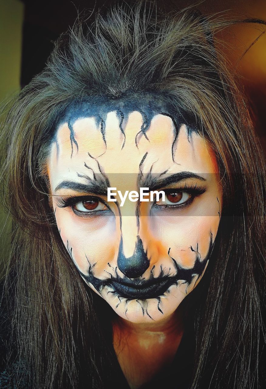Close-up portrait of woman with spooky halloween make-up