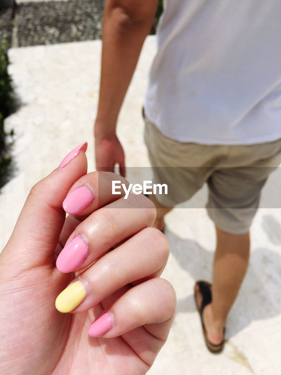 Cropped image of woman hand with nail polish