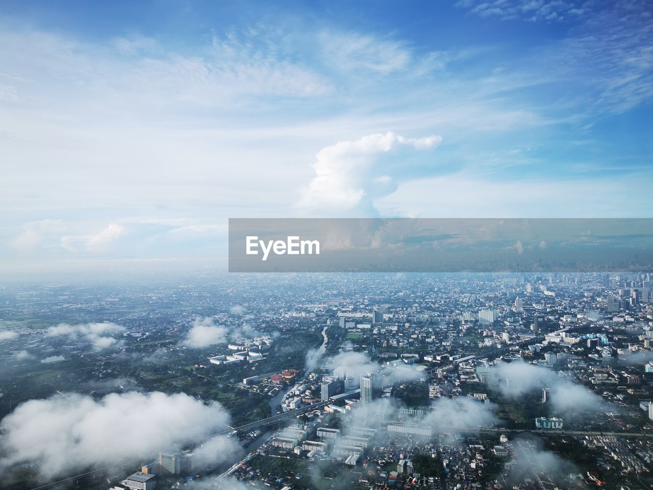 Aerial view of cityscape against sky