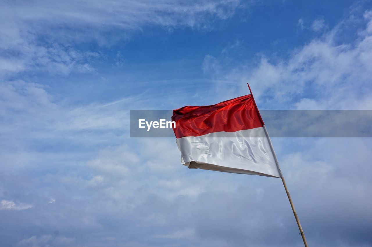 Indonesia flag fluttering in the clear blue sky