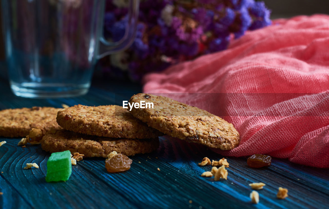 CLOSE-UP OF COOKIES ON GLASS