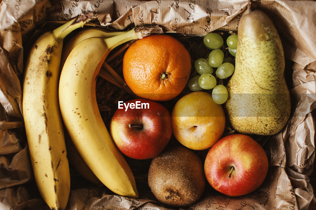 Directly above view of fresh fruits in paper bag