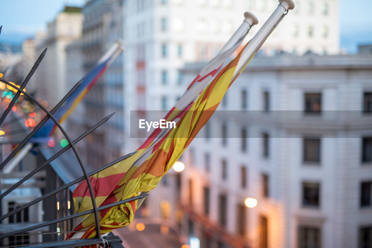 Protest suspended, rolled flag on balcony of building