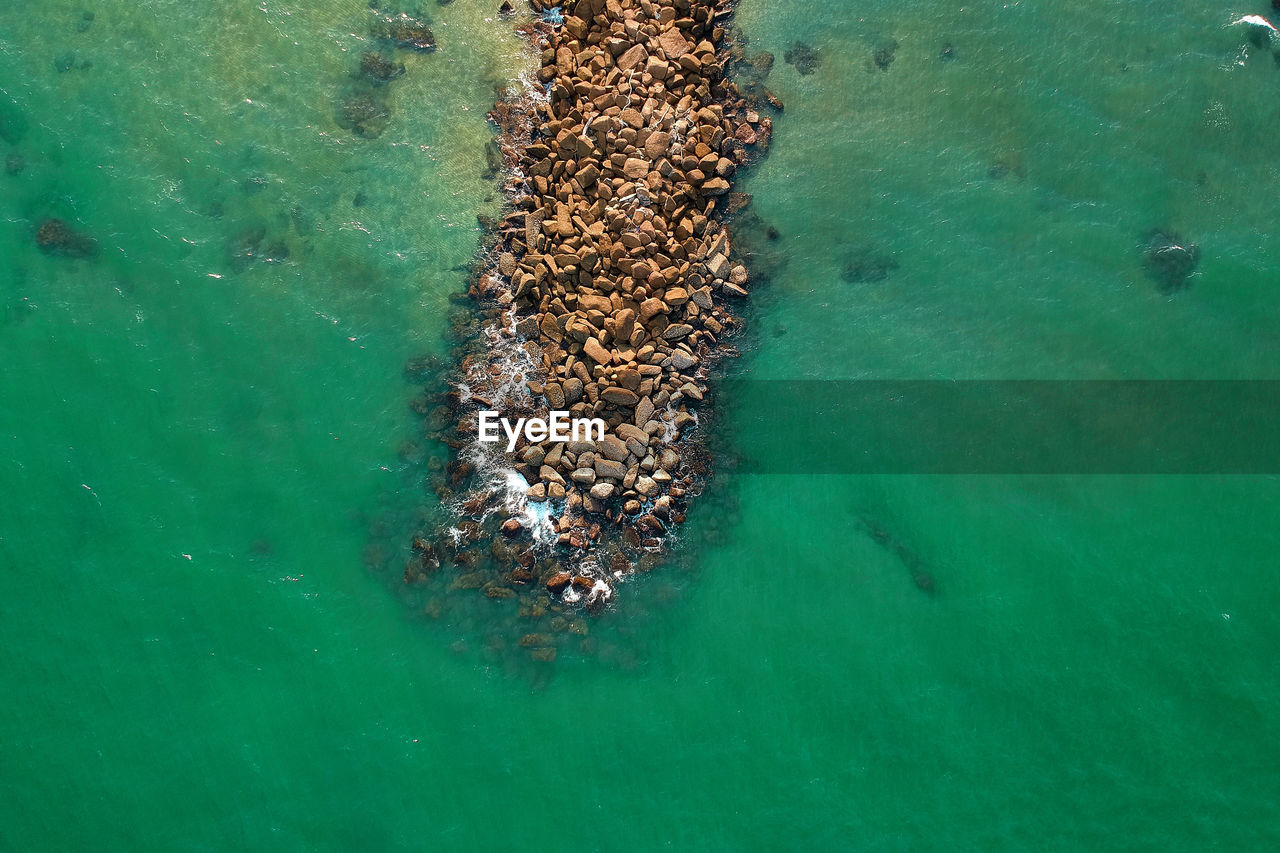 Drone view of groyne in sea