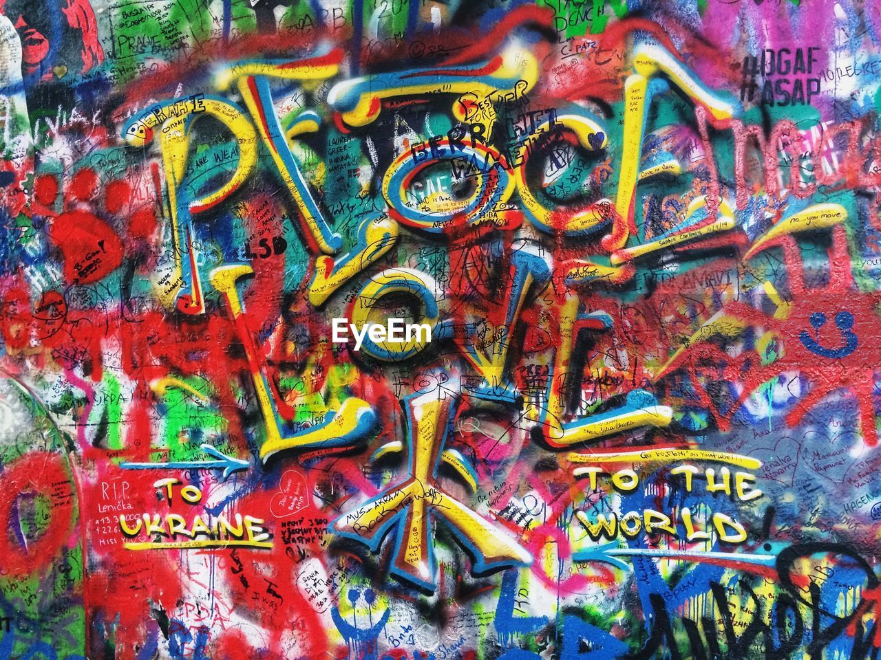 CLOSE-UP OF GRAFFITI ON METAL WALL