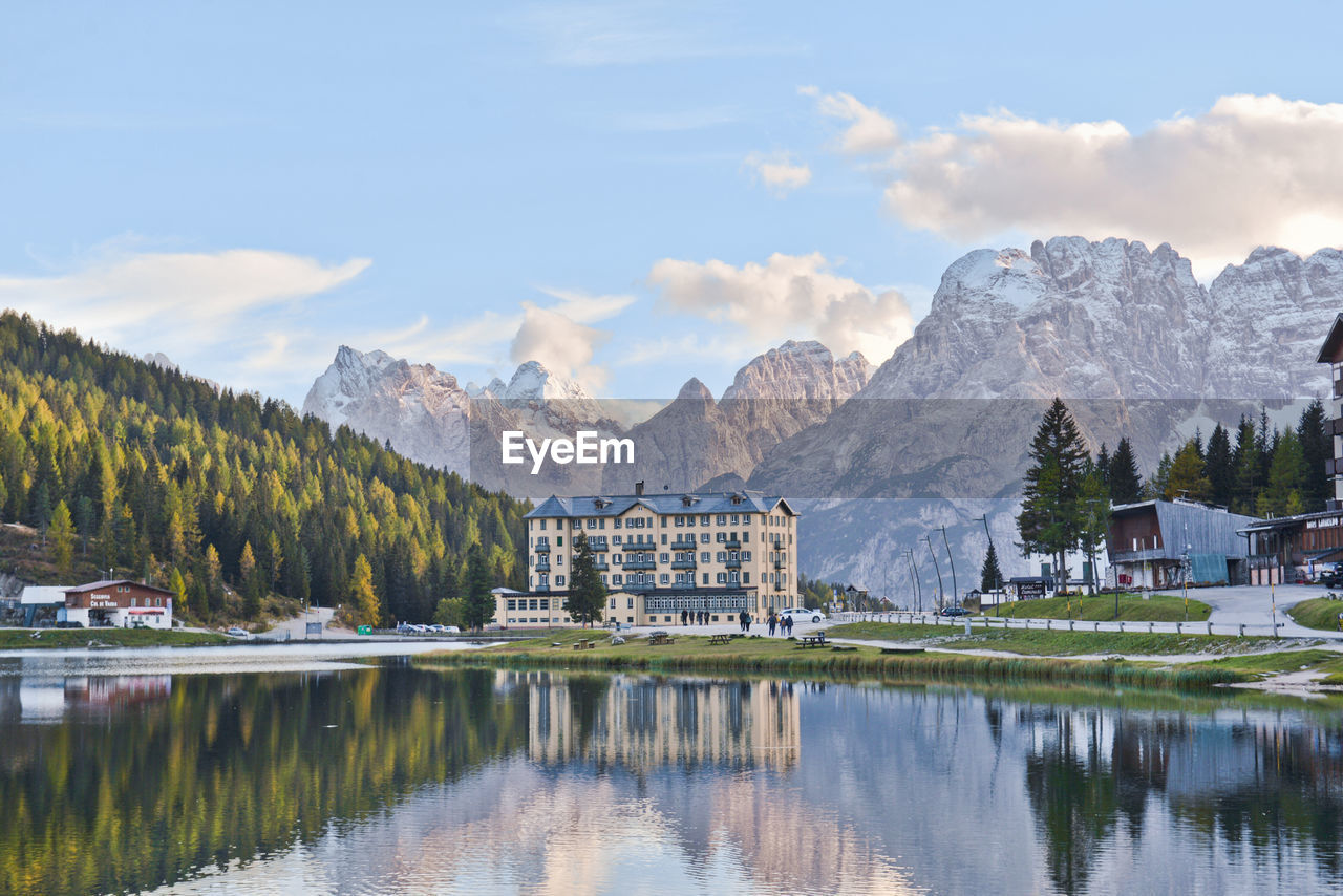 Scenic view of lake and mountains against sky