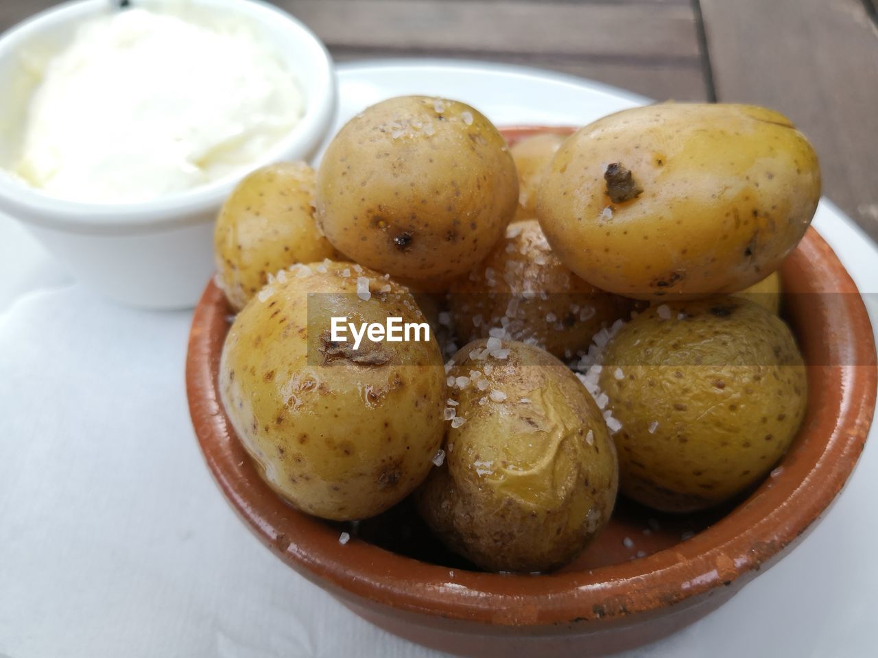 Papas arrugadas spanish tapas salty potatoes with aioli sauce in pot