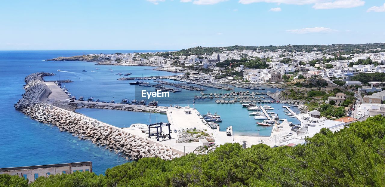 High angle view of swimming pool by sea against sky