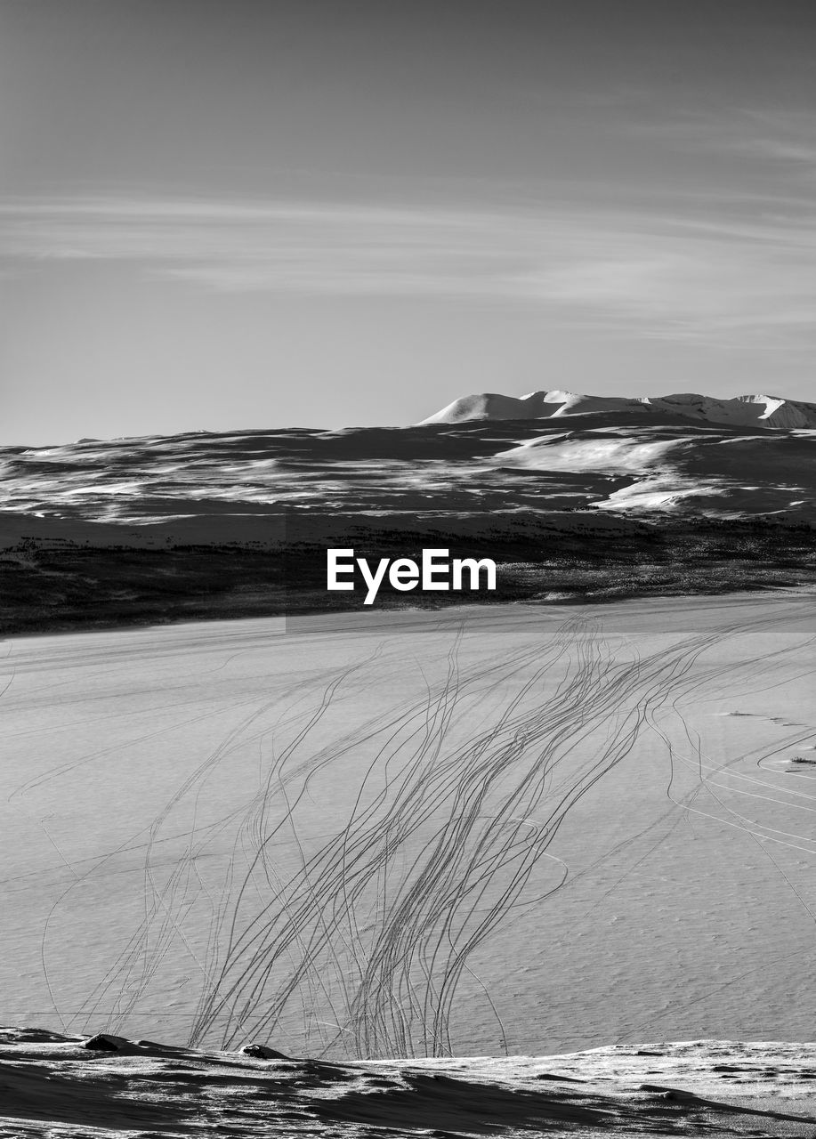 Scenic view of sea against sky during winter