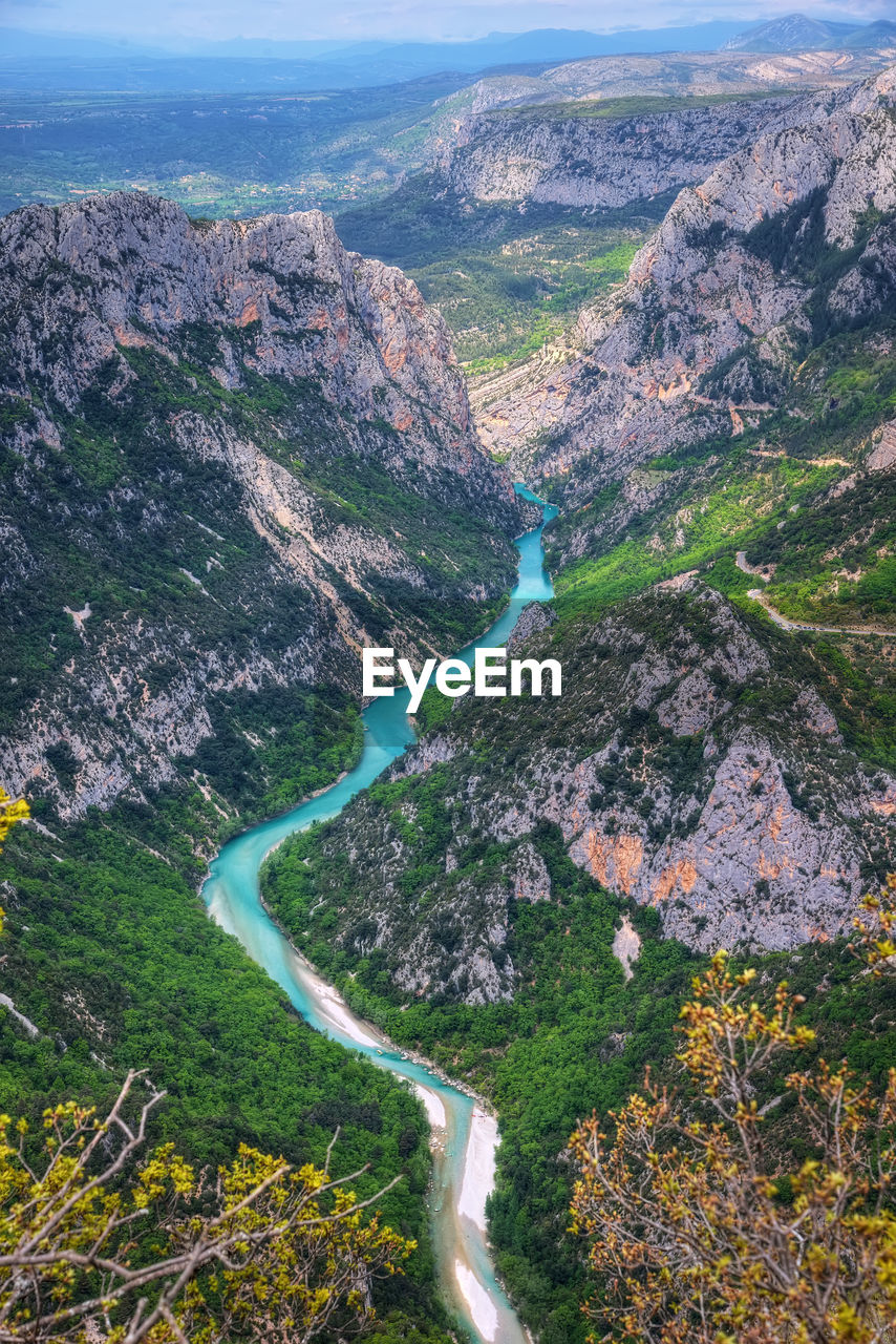 High angle view of road amidst land and mountains