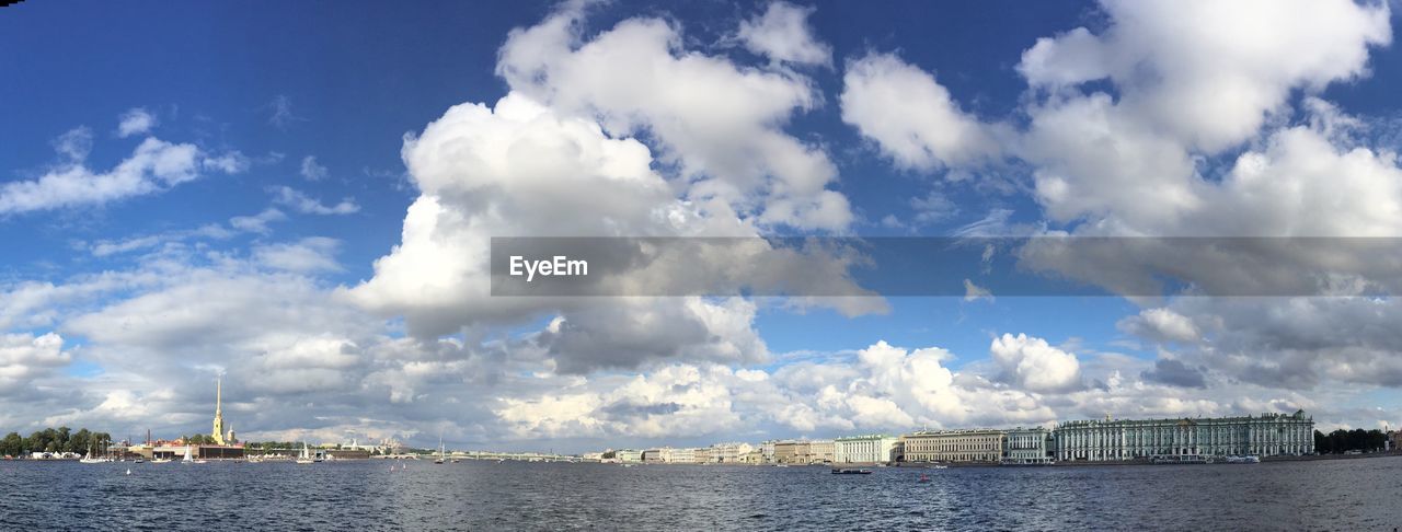 City by neva river against sky