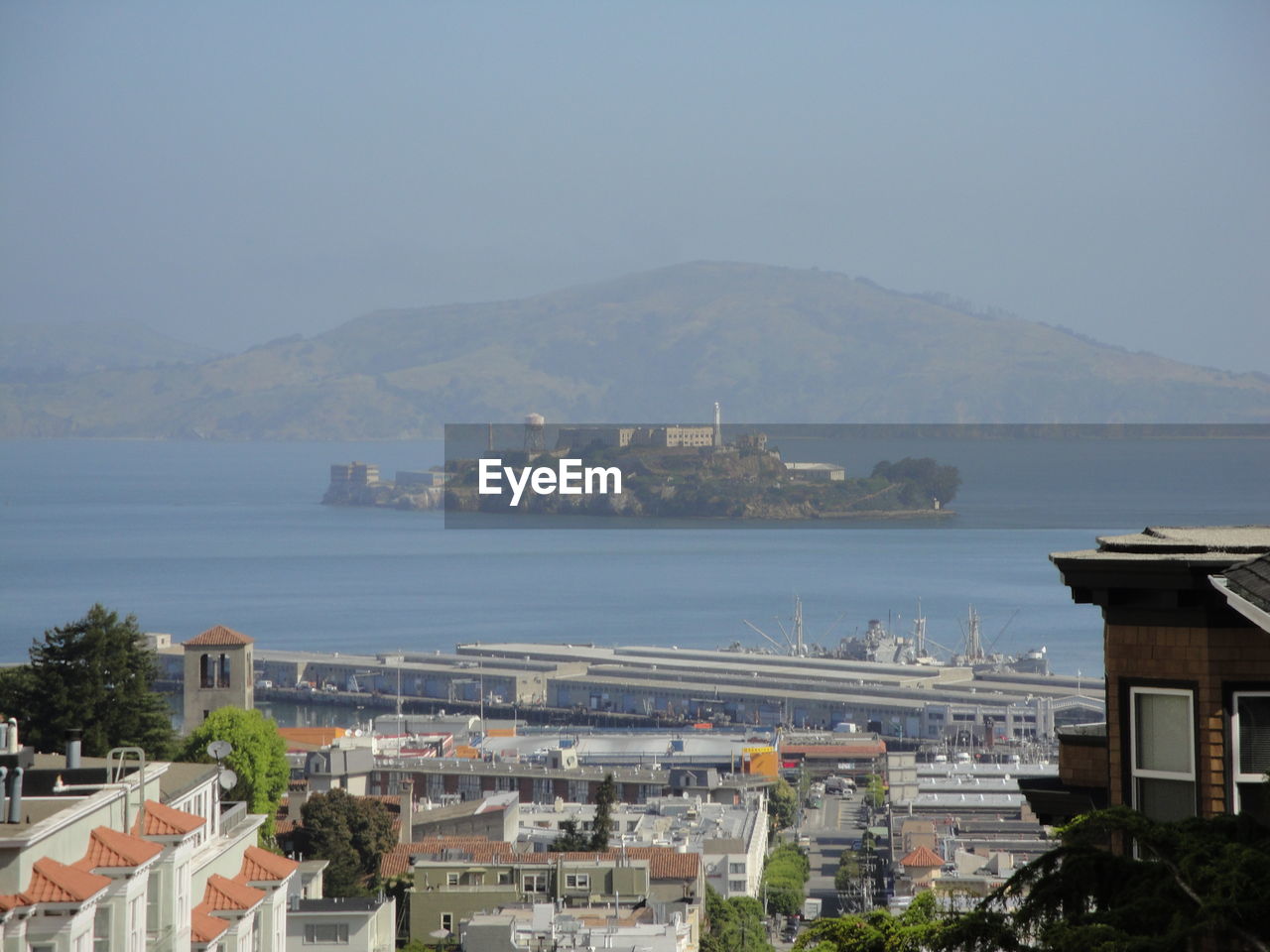 View of alcatraz island in bay against mountains