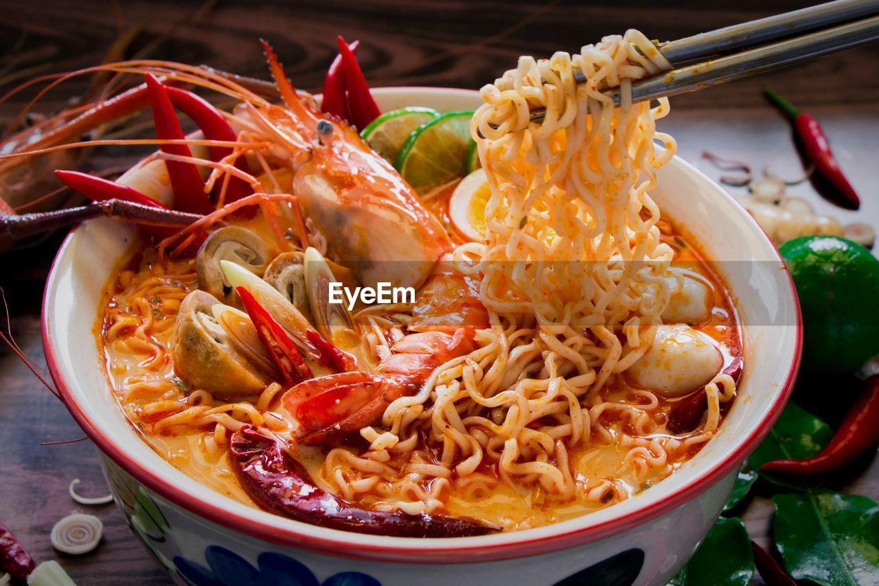 Close-up of chopsticks with pasta