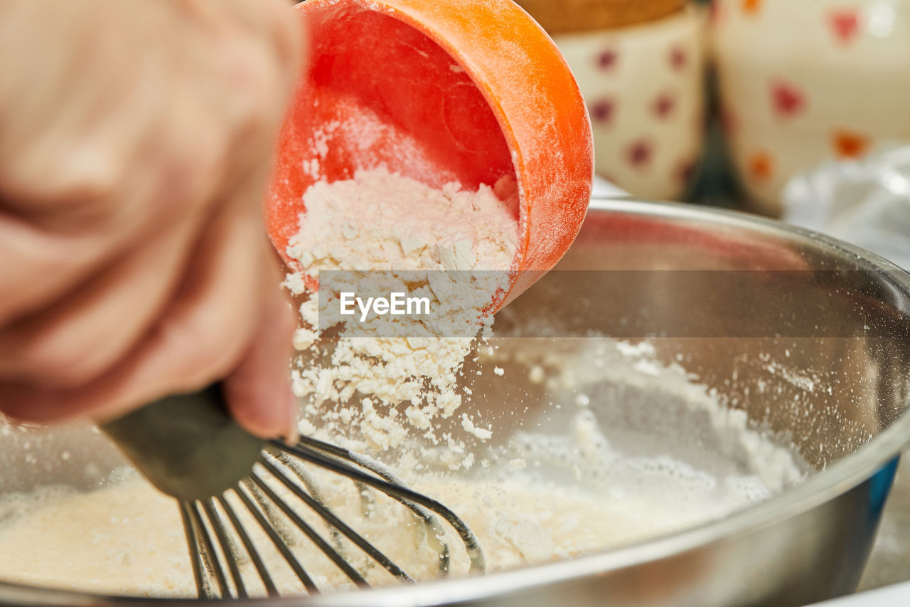 Knead the dough in bowl and add flour to it