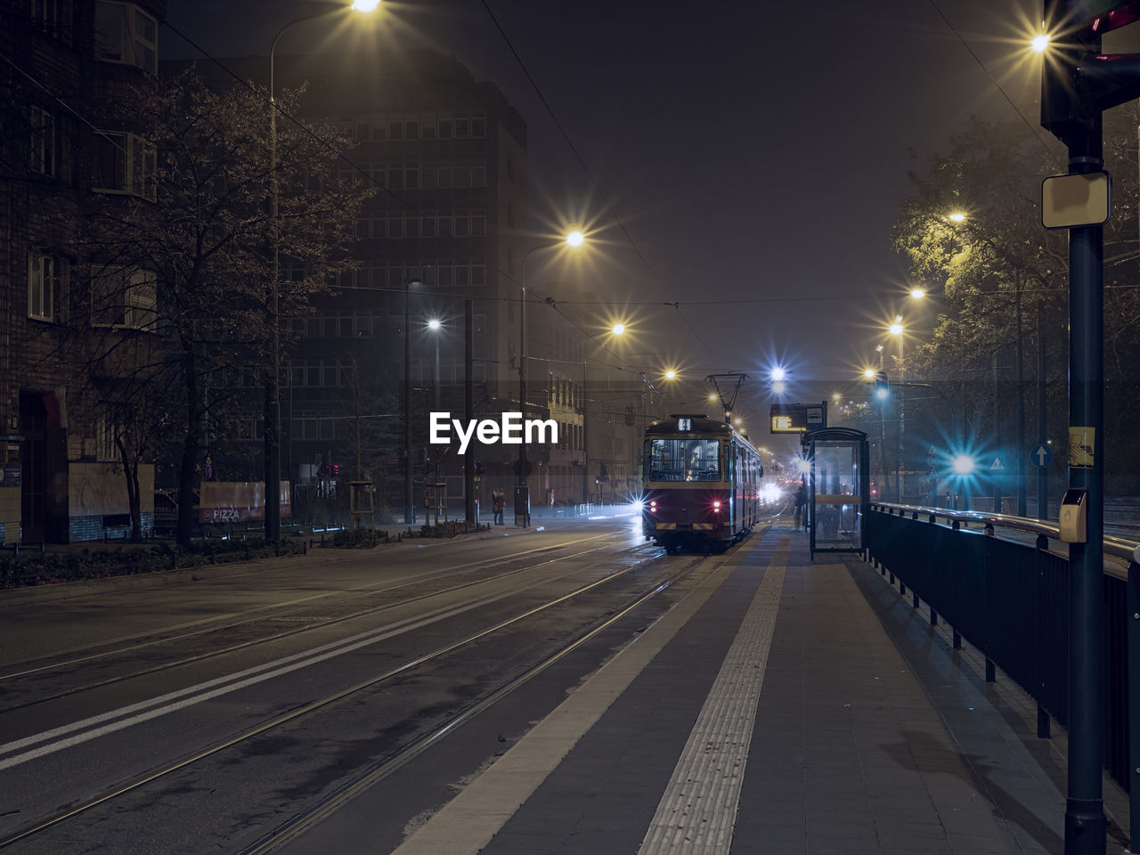 Night time tram stop waiting for passengers