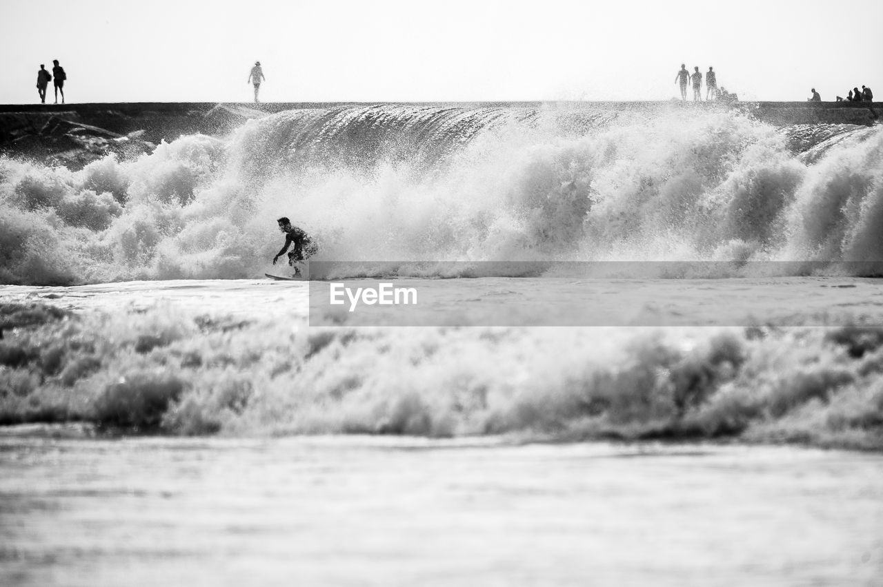 Man surfing on sea