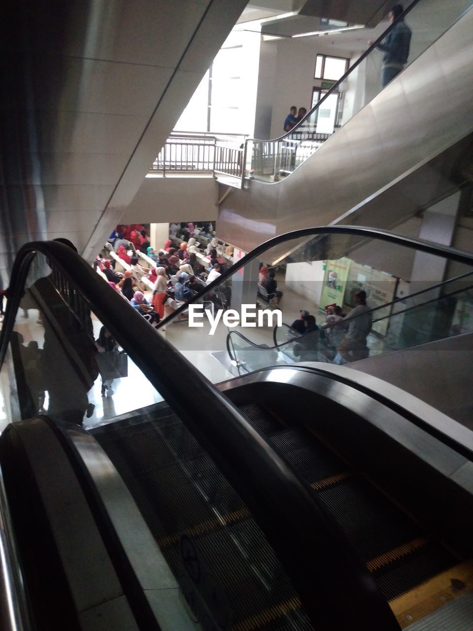 PEOPLE STANDING IN SHOPPING CART