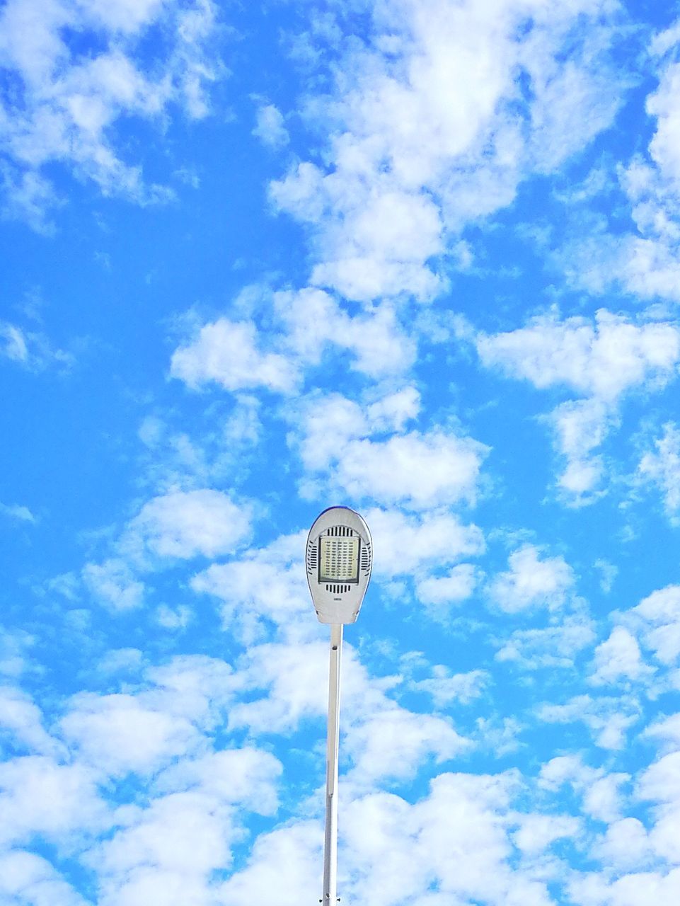 LOW ANGLE VIEW OF SIGN AGAINST BLUE SKY