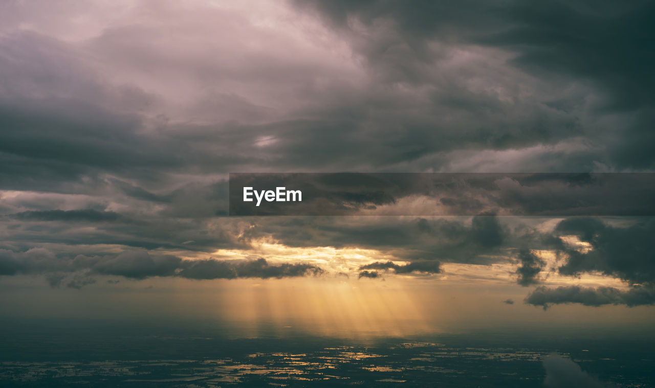 Scenic view of dramatic sky during sunset