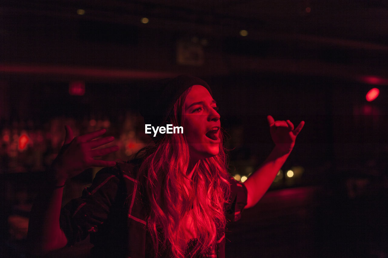 Young woman performing at a nightclub