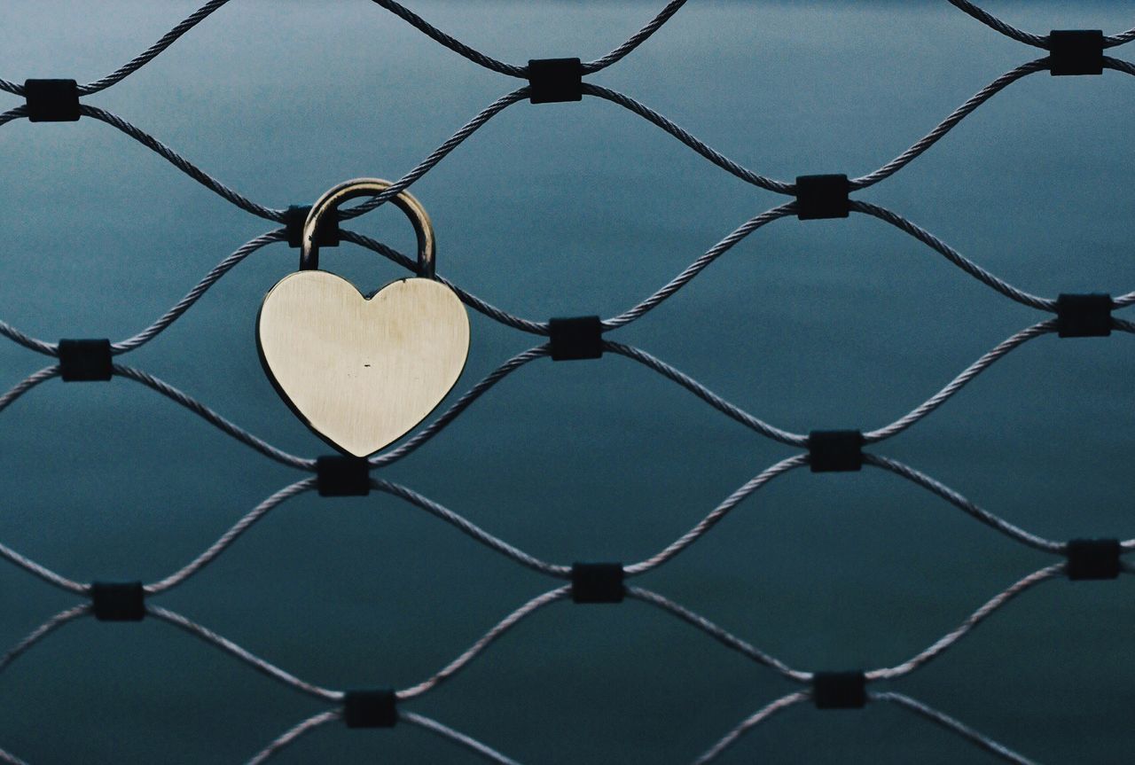 Love padlock on chainlink fence