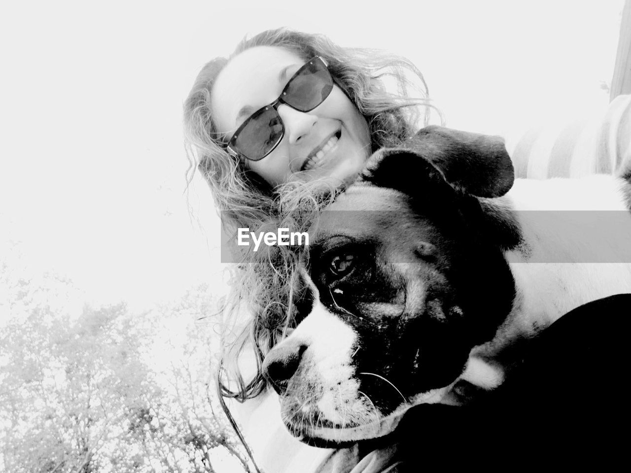 PORTRAIT OF WOMAN WITH DOG AGAINST WHITE BACKGROUND