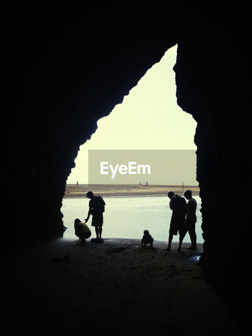 Silhouette of tourists on beach